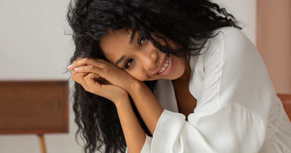 Woman with strong healthy hair smiling